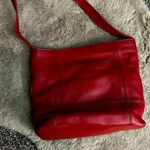 Used red leather sak purse.. in great condition.